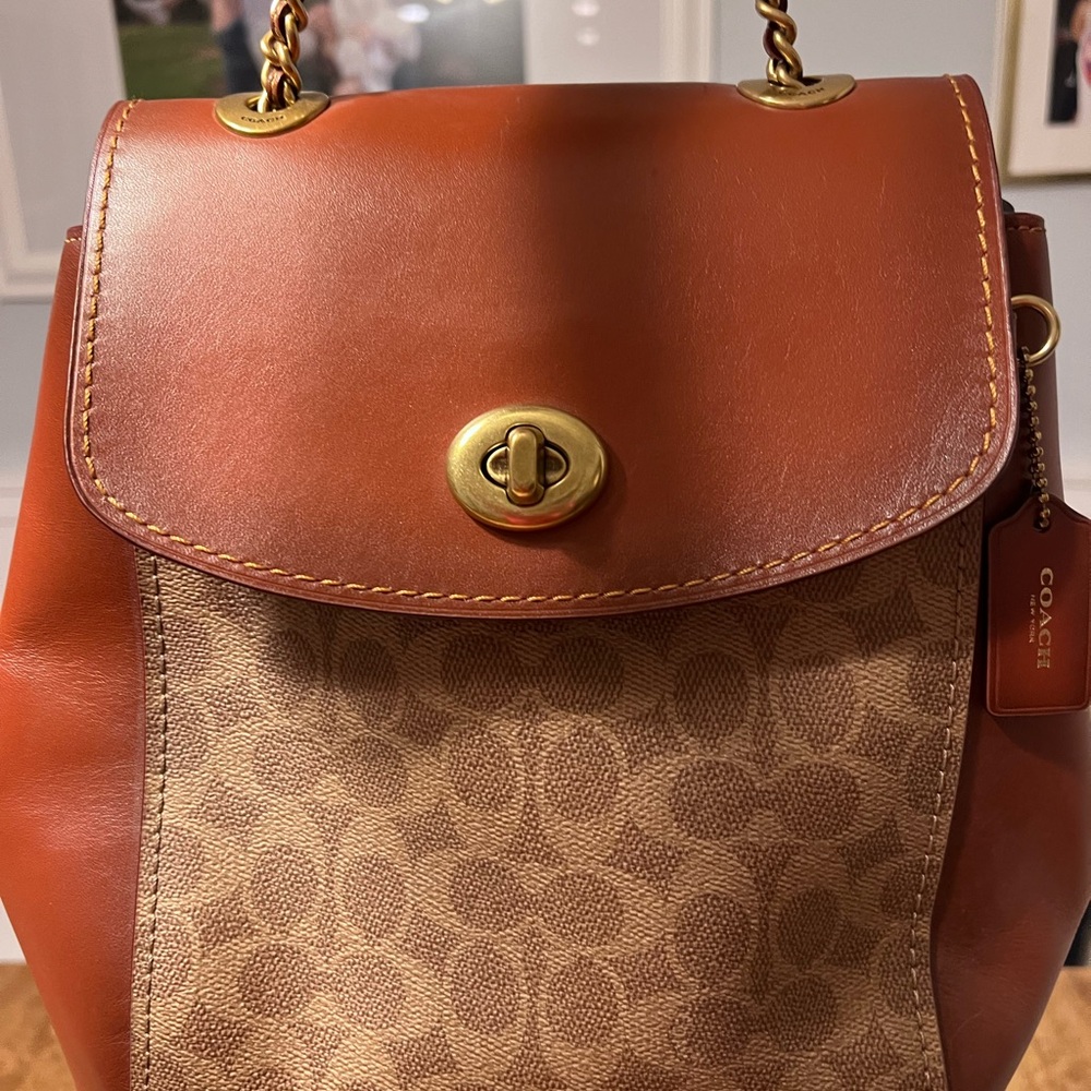 Coach backpack with matching wallet. Used a few times. One mark as seen in photo